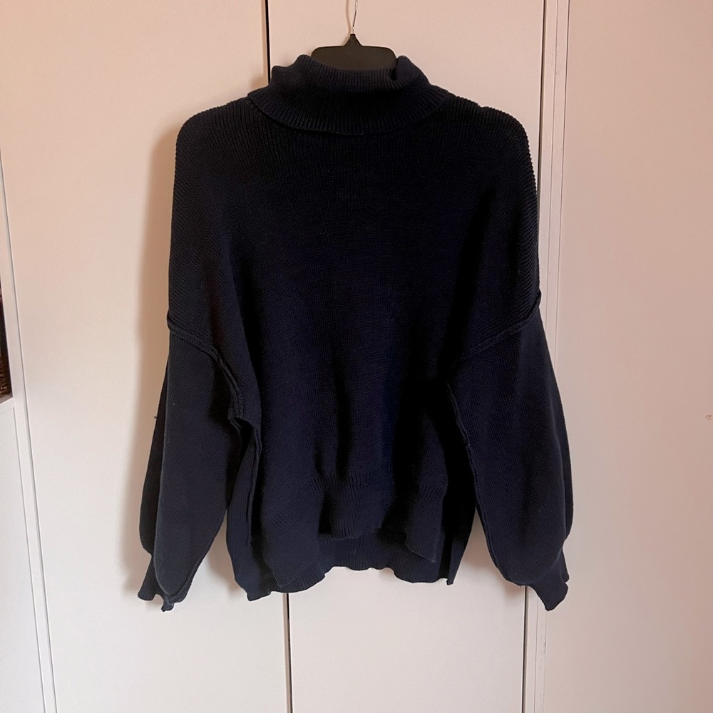 Francesca’s dark blue oversized sweater
